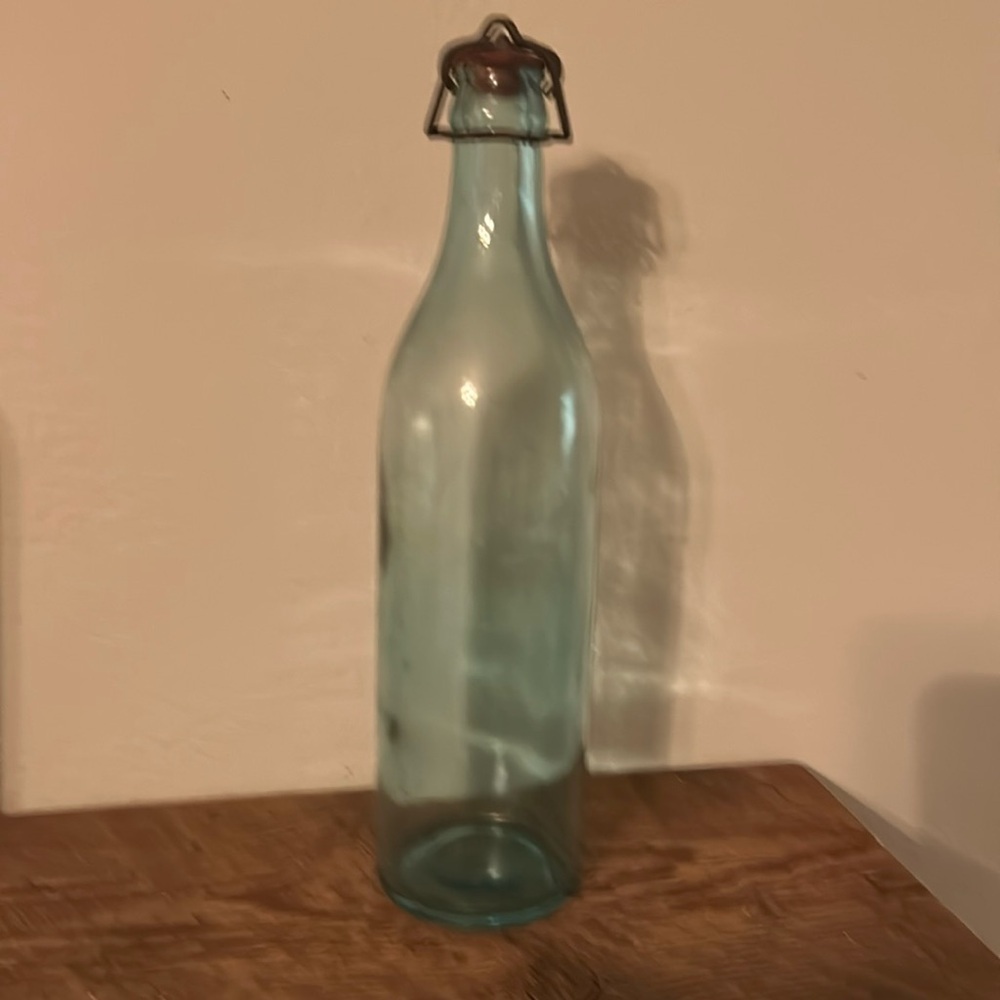 Vintage light‎ green glass bottle with original topper